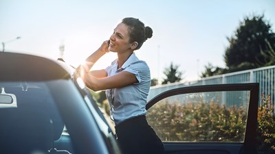 Women calling next to her leasecar